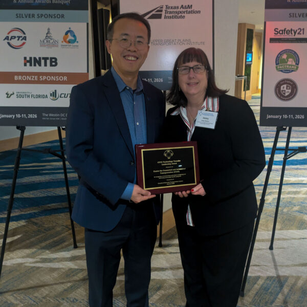 Henry Liu and Debby Bezzina holding the 2026 CUTC Technology Transfer Leadership Award