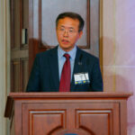 Henry Liu on stage at the 2025 UMTRI Symposium