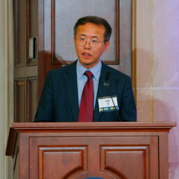 Henry Liu on stage at the 2025 UMTRI Symposium