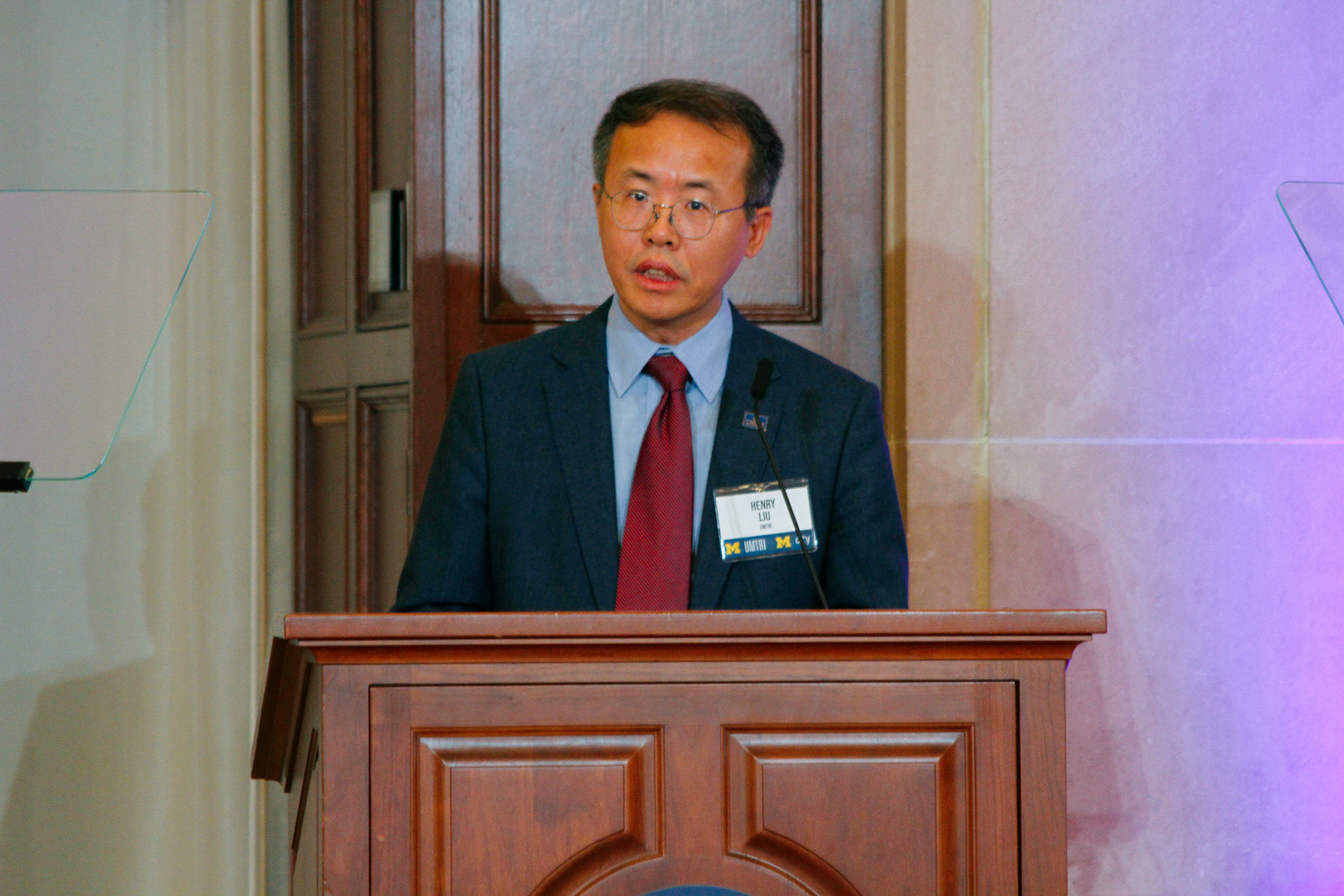 Henry Liu on stage at the 2025 UMTRI Symposium